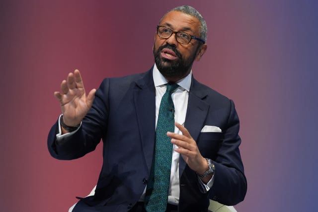 Conservative Party leadership hopeful James Cleverly turns to face the crowd at the Conservative Party Conference