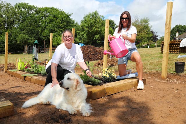 National Lottery winners, left to right, Lesley Herbert and Debbie Goolding with Zoe the dog