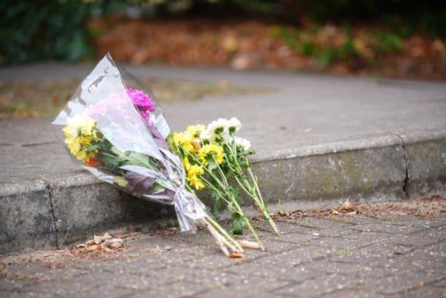 Flowers left at the scene in Chadwell Heath Lane, east London, where Zahwa Salah Mukhtar, 27, died