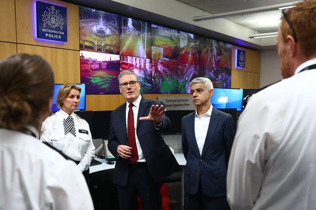 Prime Minister Sir Keir Starmer and Mayor of London Sir Sadiq Khan speak with police officers and staff ahead of Saturday's protests (Peter Nicholls/PA)