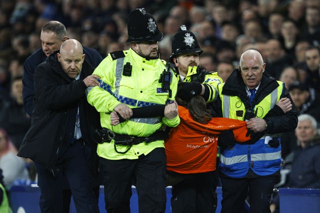 The protester was led away by police