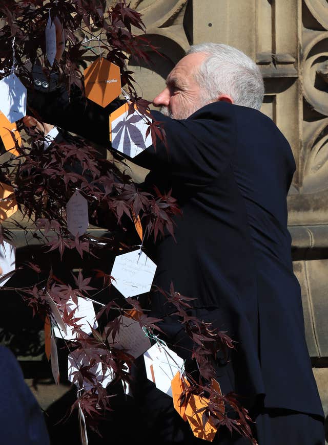 Mr Corbyn left a message on a Tree of Hope following the service (Peter Byrne/PA)