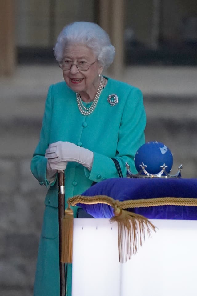 The Queen symbolically leads the lighting of the principal jubilee beacon at Windsor Castle