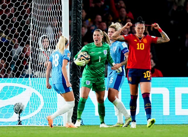 Mary Earps celebrates saving Jennifer Hermoso's penalty in the World Cup final