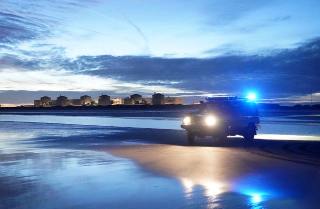 French police vehicle on the beach in Gravelines, France at dawn 