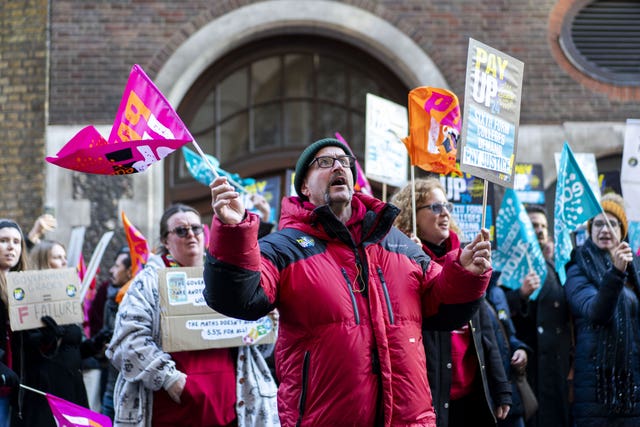 Members of the National Education Union (NEU) hold a rally outside the Department for Education (DfE) in London