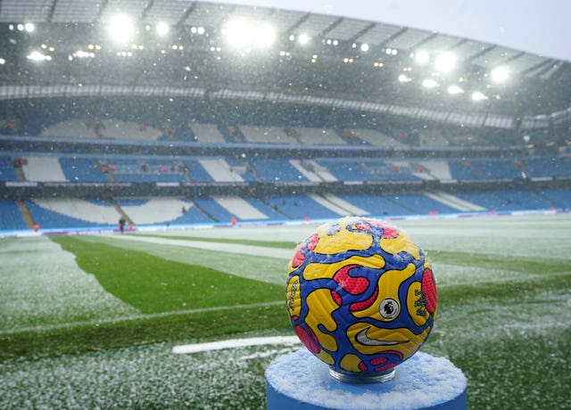 The match ball on a pedestal in the snow before the Premier League match between Manchester City and West Ham