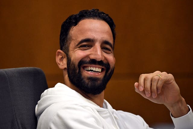 Sporting Lisbon manager Ruben Amorim laughs at a press conference