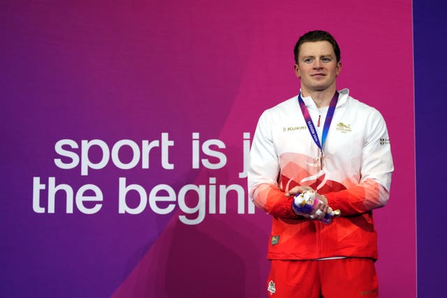 Adam Ramsay-Peaty celebrates bronze in the men’s 50m breaststroke finalr