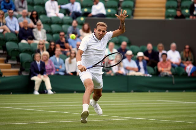 Dan Evans plays a backhand volley during his victory over Feliciano Lopez
