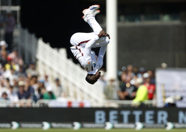 The West Indies’ Kevin Sinclair celebrates with a backflip after taking the wicket of England’s Harry Brook, not pictured