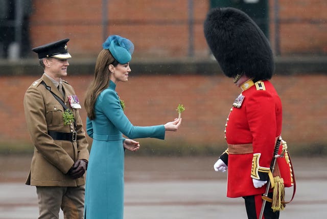 The Princess of Wales presents the traditional sprigs of shamrock to officers and guardsmen of the 1st Battalion Irish Guards for the St Patrick’s Day Parade, at Mons Barracks in Aldershot in 2023
