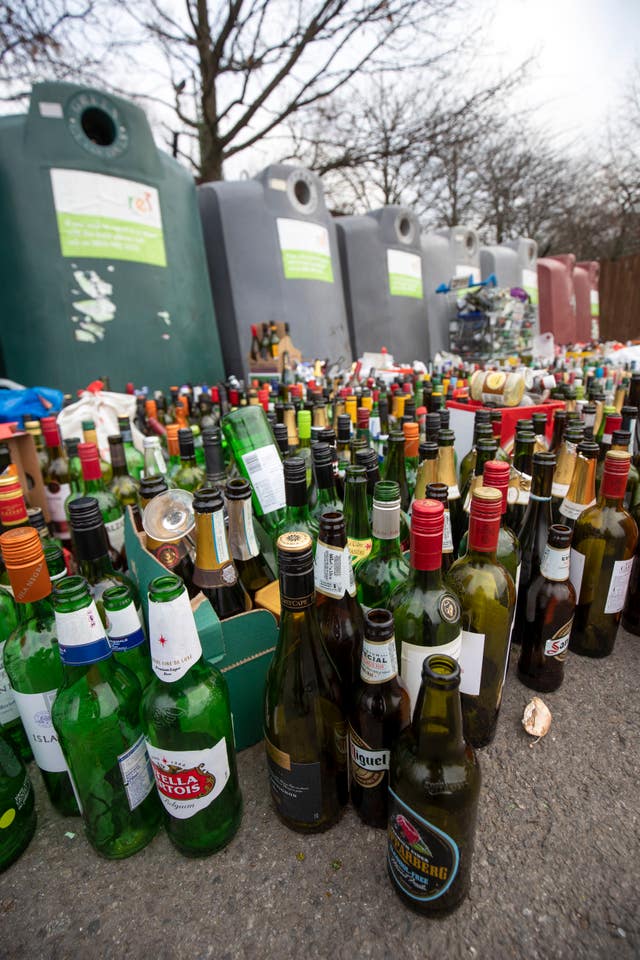 Bottles in front of a bottle bank at a recycling centre at a supermarket near Bracknell, Berkshire, after the Christmas and New Year period (Steve Parsons/PA)
