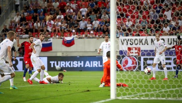 Adam Lallana, second left, scores the only goal in Sam Allardyce's solitary game in charge of England, against Slovakia in Trnava
