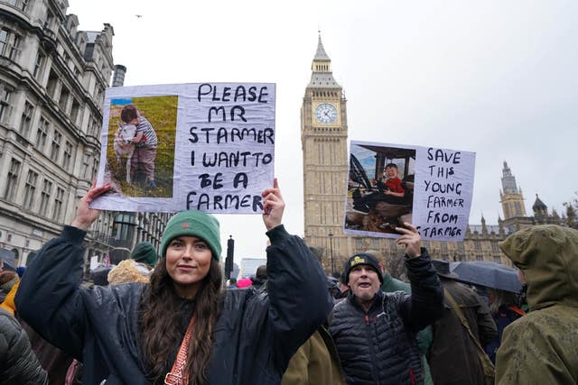 Protester holding up a sign which reads: Please Mr Starmer I want to be a farmer