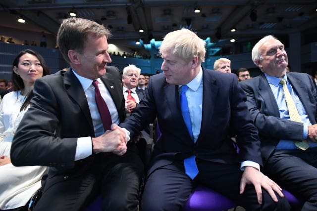 Jeremy Hunt congratulates Boris Johnson at the Queen Elizabeth II Centre in London where he was announced as the new Conservative Party leader