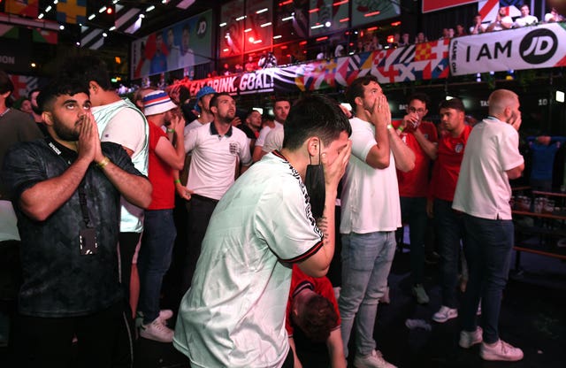 England fans at BOXPARK Croydon react as England lose on penalties