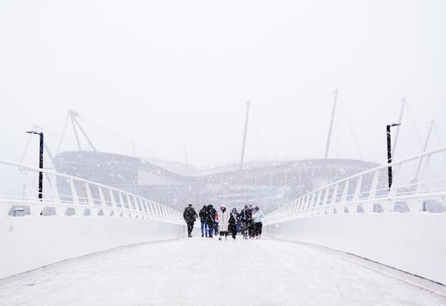 The approach to Manchester City's Etihad Stadium is shrouded in snow