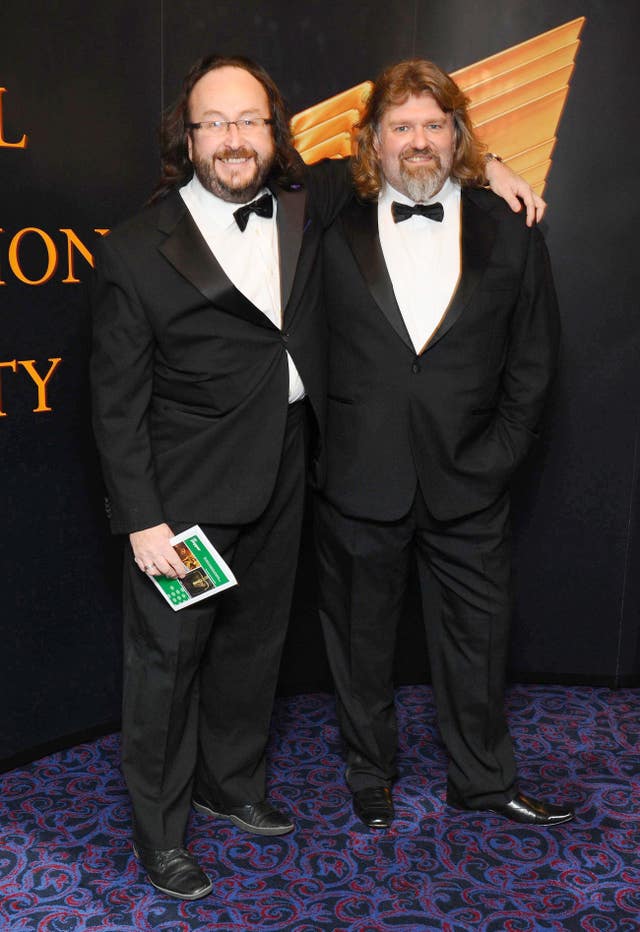 The Hairy Bikers - Si King and Dave Myers - standing together and dressed for a black tie event