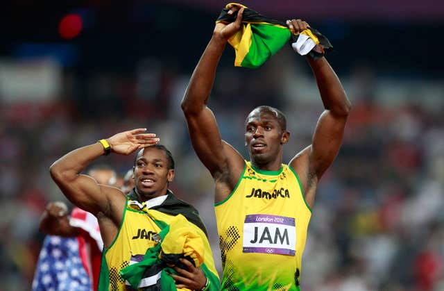 Usain Bolt (right) and Jamaica's Yohan Blake celebrate a new world record