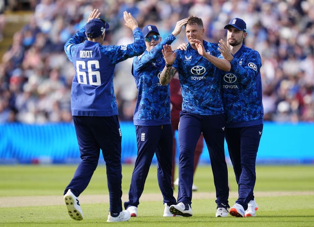 England's Brydon Carse (second right) celebrates taking the wicket of West Indies' Brandon King