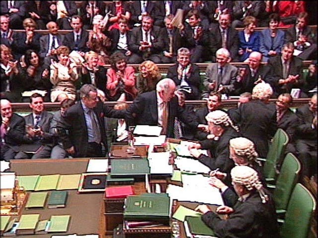 Michael Martin, centre, being 'dragged' to the Speaker’s chair by colleagues after being voted in as new House of Commons Speaker in 2000