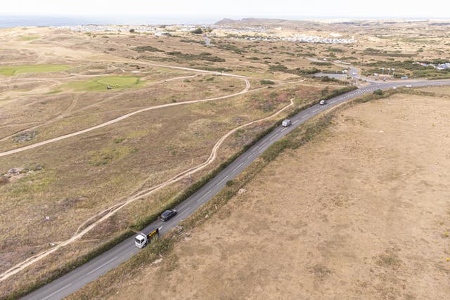 Aerial view of dry fields of grassland and a golf course near Perranporth, Cornwall