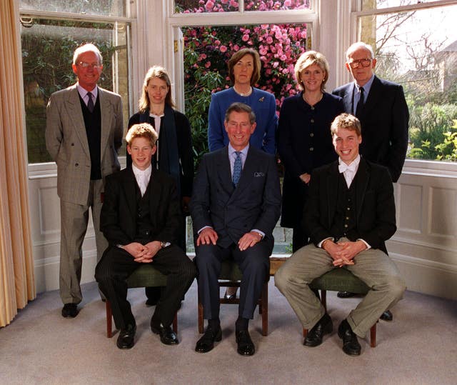 Harry pictured with father Charles and brother William during his Confirmation at Eton, and behind are his god parents Bryan Organ, Lady Sarah Chatto, Lady Vestey, Carolyn Bartholomew and Gerald Ward. PA