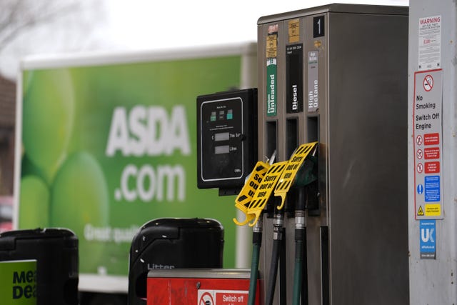 Petrol pumps with 'not in use' labels on them
