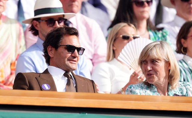 Roger Federer, left, watched Arthur Fery 