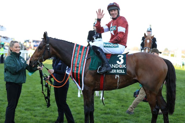 Davy Russell celebrates winning the National with Tiger Roll