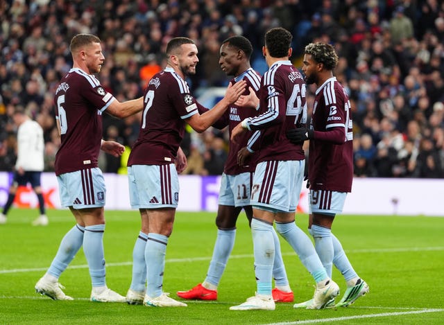 Aston Villa players celebrate the third goal