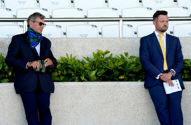 Mark Johnston (left) and his son Charlie watching the action at Goodwood 