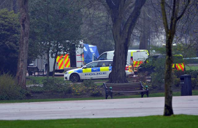 Police at the scene after a girl’s body was found in West Park, Wolverhampton (PA)