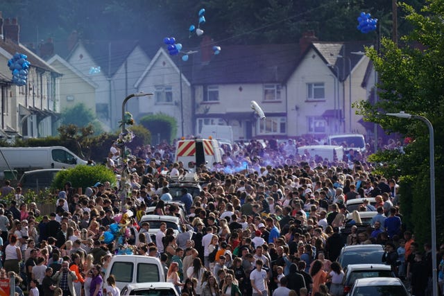 Balloons are released during the vigil in Snowden Road (Jacob King/PA)