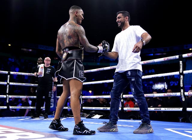 Conor Benn (left) is congratulated by Amir Khan