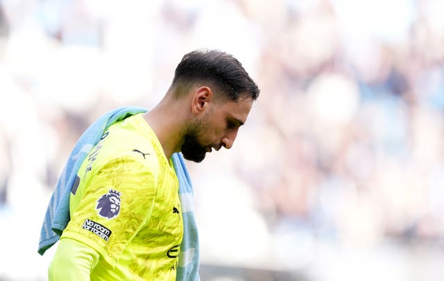 Manchester City goalkeeper Gianluigi Donnarumma bows his head