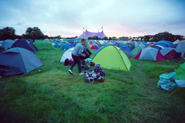 Festival goers pack away their pitch