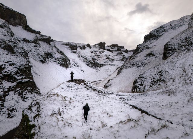 Walkers on Winnats Pass in the Peak District, Derbyshire