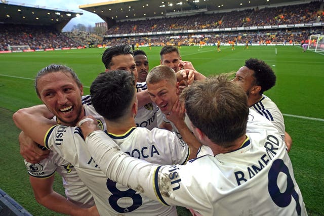 Rasmus Kristensen, centre, and Leeds celebrate their third goal