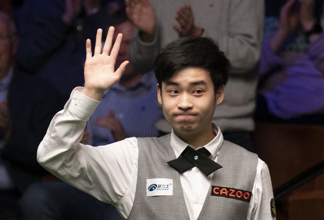 Si Jiahui celebrates victory at the Crucible