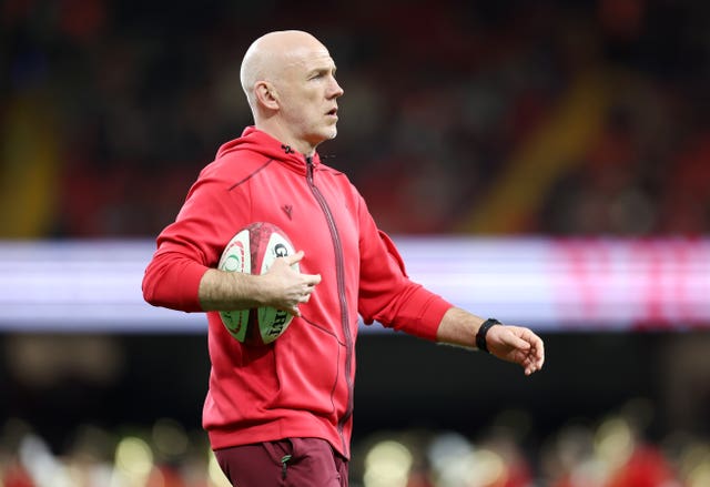 Wales head coach Steve Tandy holds a rugby ball