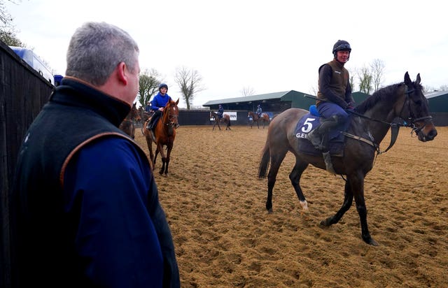 Gordon Elliott looks on as Conflated returns from the gallops during a visit to Gordon Elliott’s yard at Longwood in County Meath, Ireland