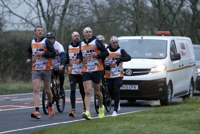 Kevin Sinfield, front right, has been accompanied by Steve Cram, front left, for parts of day two and day three during his Ultra 7 in 7 Challenge