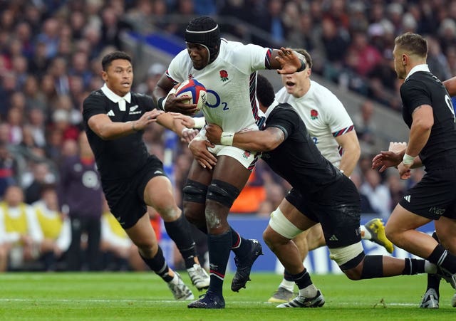 Maro Itoje carries the ball into New Zealand's defence at Twickenham