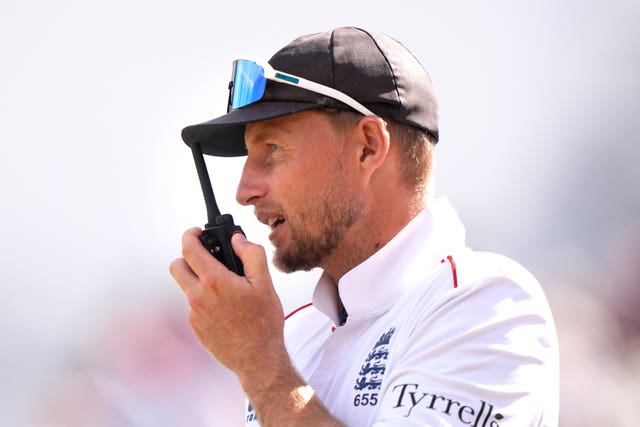 Joe Root on a walkie-talkie