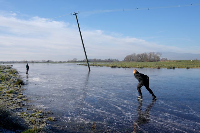 A person skates on a frozen field in Cambridgeshire