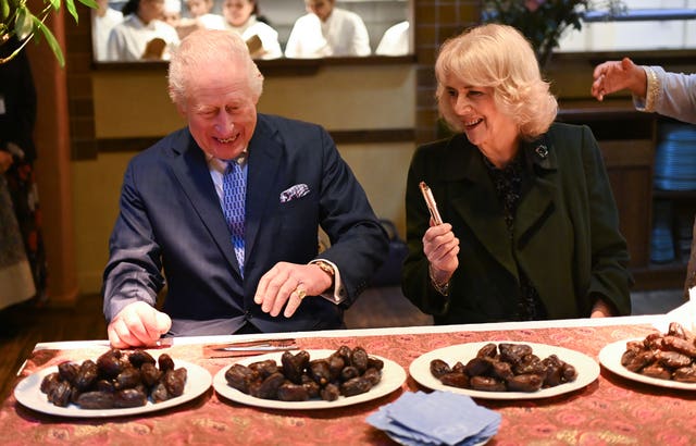 The King and Queen with plates of dates