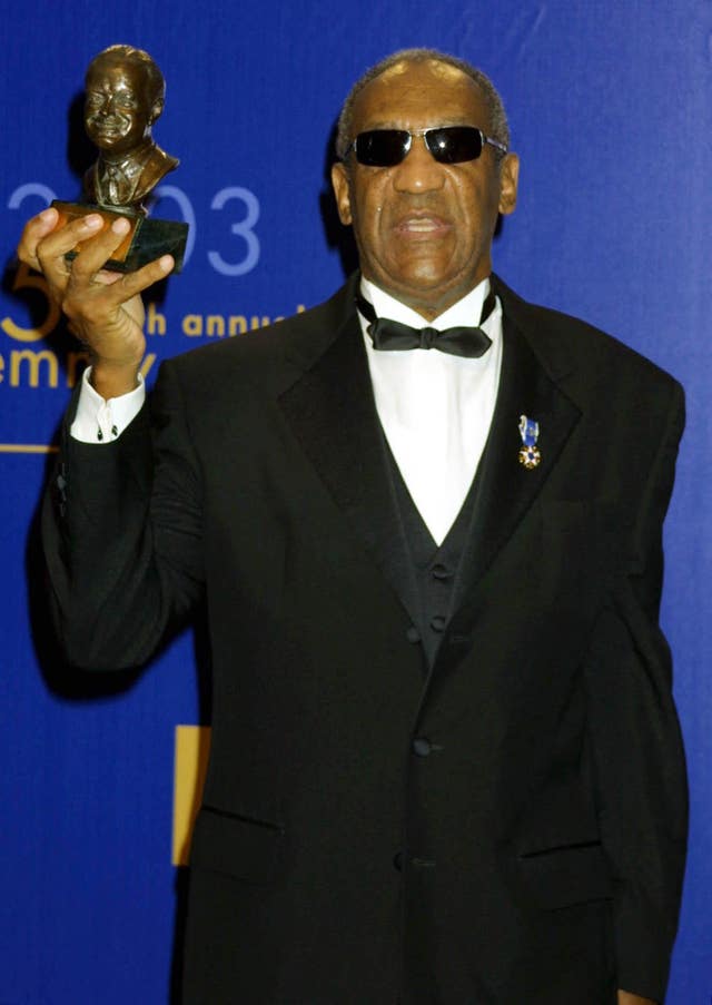 Actor Bill Cosby holding the Bob Hope Humanitarian Award during the 55th Annual Primetime Emmy Awards at the Shrine Auditorium in Los Angeles