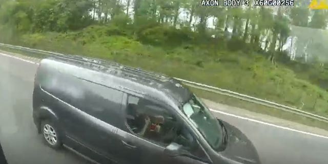 A van driver driving without his hands on the wheel eating fast food on the M6 in Coventry